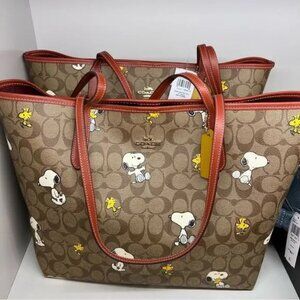 Coach X Peanuts City Tote In Signature Canvas With Snoopy Woodstock Print
